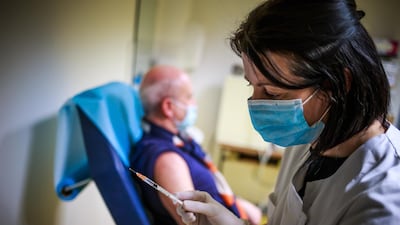 French nurse Karine Groen prepares a dose of the Pfizer/BioNTech shot. EPA