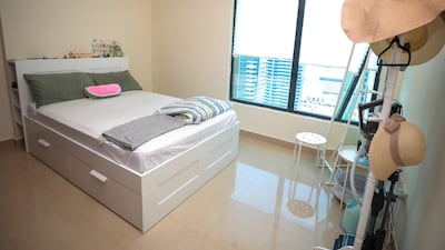The master bedroom has a large window offering views of the water