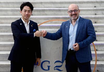 Japan's Environment Minister Shinjiro Koizumi, seen with Italian Ecological Transition Minister Roberto Cingolani in Naples in July, is a rising star within the LDP. AFP