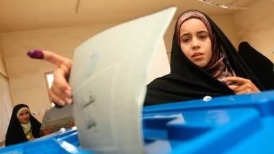 An Iraqi woman casts her ballot in her country's general elections on March 7 in Baghdad's Sadr City.