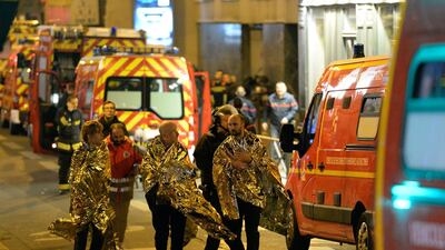 People are evacuated near the Bataclan concert hall in central Paris, following the series of coordinated attacks by gunmen in November 2015. AFP