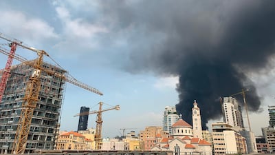 Thick black columns of smoke rise into the sky, in Beirut. AFP