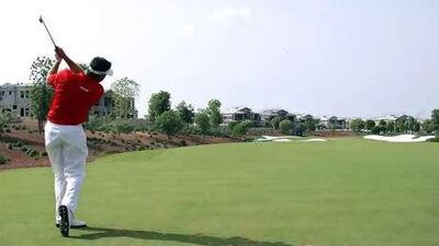 England's Lee Westwood plays a shot at the Earth Course at Jumeirah Golf Estates.