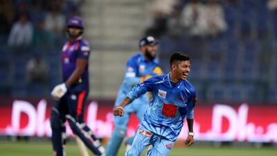 Karnataka Tuskers' Sandeep Lamichhane celebrates the run out of Colin Ingram. Chris Whiteoak / The National