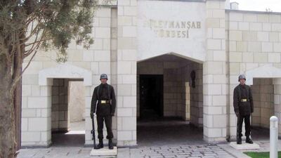 Turkish soldiers stand guard at the entrance of the memorial site of Suleyman Shah, in Syria's Aleppo Province in 2011. AP Photo