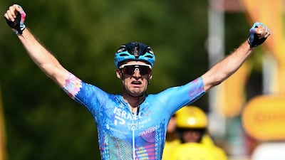 Israel-Premier Tech rider Hugo Houle celebrates after winning Stage 16 of the 2022 Tour de France on Tuesday, July 19, 2022. AFP