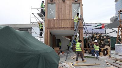 Workers get ready for the International Defence Exhibition and Conference (Idex) taking place in Abu Dhabi next week.