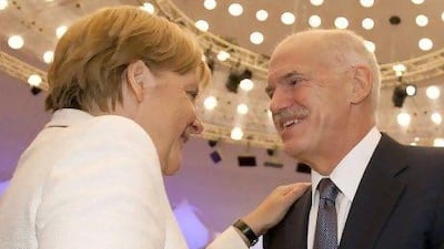 Angela Merkel, the German chancellor, welcomes George Papandreo, the Greek prime minister, during a meeting in Berlin yesterday. Reuters