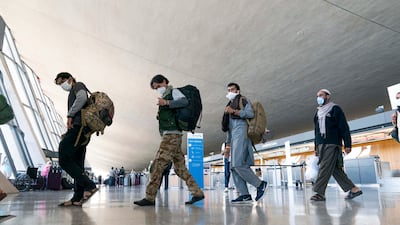 People who fled the Taliban in Afghanistan arrive at Washington Dulles International Airport in the US. AP
