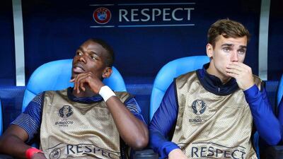 Paul Pogba, left, and Antoine Griezmann were among the France substitutes. Oliver Weiken / EPA