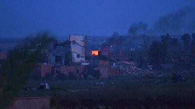 Smoke rising over the village of Baghouz in the eastern Syrian province of Deir Ezzor. AFP