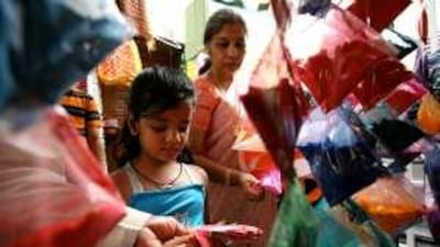 Shoppers buying colour powders and water guns for their children in Bur Dubai for Holi.