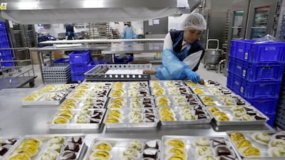 The Emirates Airlines catering facility located in the Cargo Village that serves Emirates flights along with other airlines flying out of the Dubai Airport. Dessert trays are sorted and packed. Antonie Robertson / The National