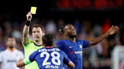 Chelsea's Cesar Azpilicueta is shown a yellow card by referee Felix Zwayer. Reuters