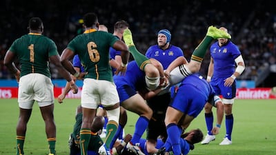 Duane Vermeulen of South Africa is spear-tackled by Italy's Andrea Lovotti and Nicola Quaglio at the Rugby World Cup on Friday. The two props have each been given three-game bans. Reuters