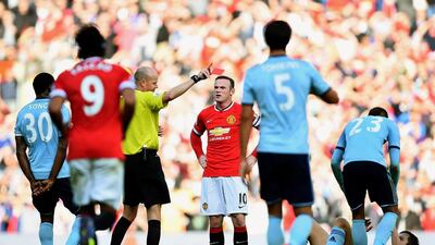 Wayne Rooney of Manchester United receives a straight red card by referee Lee Mason after a foul on Stewart Downing of West Ham United during their English Premier League match at Old Trafford on Sunday. Laurence Griffiths / Getty Images