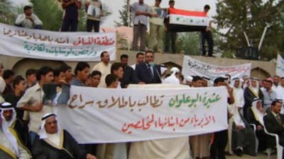 Iraqi Sunni Muslims demonstrate on October 25, 2008 in Fallujah to protest against the killing of one of their member by the US troops during a raid in town.