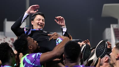 Al Ain manager Vladimir Ivic celebrates winning the title