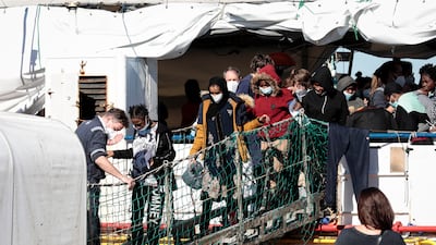 Some of the 440 migrants disembark from ‘SeaWatch 3’ in Pozzallo, Sicily. EPA