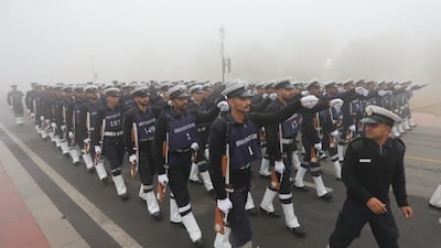 Indian paramilitary soldiers take part in Republic Day parade rehearsals in heavy smog on a winter morning in New Delhi. EPA