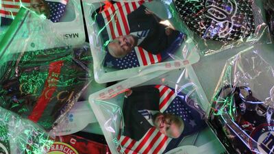Face masks with the image of Democratic U.S. presidential nominee Joe Biden are displayed for sale at Times Square in New York City. Reuters