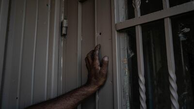 Ahmad Zboun stands next to bullet holes on his balcony in the Azzeh refugee camp. At least 25 Palestinians were killed in confrontations with Israeli forces in the West Bank and occupied East Jerusalem. Getty Images