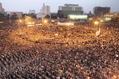 Egyptian protesters take part in a demonstration on February 1, 2011 at Cairo’s Tahrir Square as massive tides of protesters flooded Cairo for the biggest outpouring of anger yet in their relentless drive to oust president Hosni Mubarak's regime. AFP