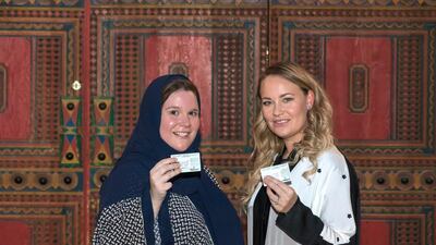 Laura Alho and Kelly Downing show off their new driving licences in Riyadh. Abdul Ahad for The National.