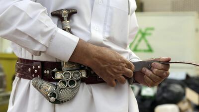 Misfer Al Qahtani, a 70 year-old retired National Guard officer wears his traditional Saudi dagger.