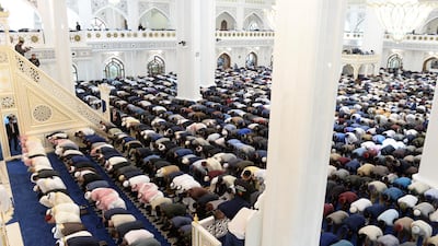 Muslims pray at a new mosque named after the Prophet Mohammed.