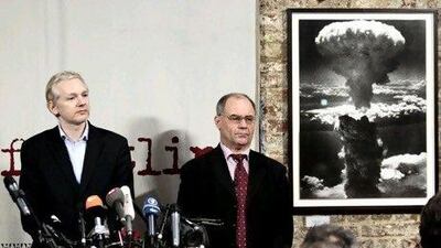 Julian Assange, left,and Rudolf Elmer.