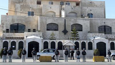 Jordanian riot policemen stand guard outside the Syrian embassy in Amman on December 2, 2011 during a demonstration by Syrians living in Jordan against the Syrian regime and its deadly crackdown on dissidents. AFP
