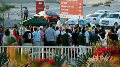 Cricket fans wait for taxis after a day’s play in the Pakistan versus England Test match.