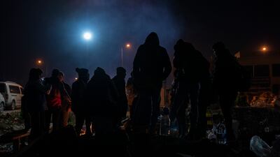 Volunteers keep warm around a fire in Antakya. Matt Kynaston.