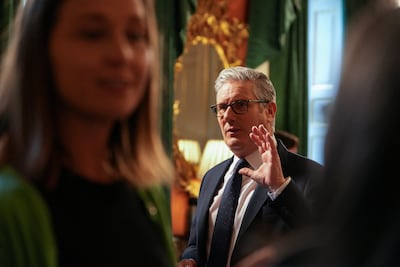 Britain's Prime Minister Keir Starmer speaks with families. CARLOS JASSO / Pool via REUTERS
