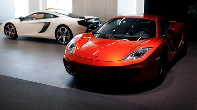 Cars on display in the McLaren showroom in Dubai. The company recently received funding from a group of investors, including Saudi Arabia's PIF. Sarah Dea/The National