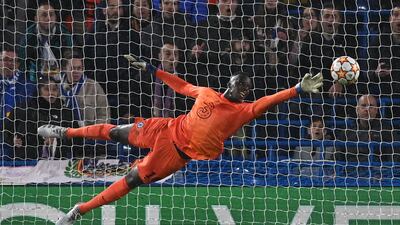 CHELSEA RATINGS: Edouard Mendy - 4: Helpless in first half as Vinicius Junior hit bar and Benzema sent two perfect headers into the net. Catastrophic pass to Rudiger gifted Benzema his hat-trick for Real's crucial third and looked shaky for rest of game. AFP