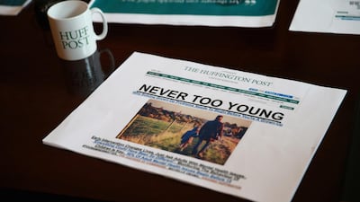 A printout of the Huffington Post's online front page lies on the table during a meeting in the Huffington Post 'News Room'. Chris Jackson / WPA Pool / Getty Images