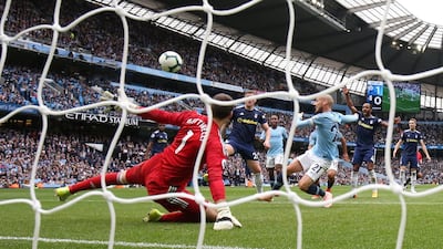 Manchester City's David Silva scores their second goal past Fulham's Marcus Bettinelli in their 34th unbeaten match in a row against promoted teams at the Etihad Stadium. Action Images via Reuters