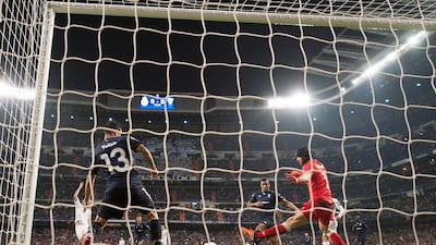 Karim Benzema of Real Madrid scores their first goal on Tuesday night against Malmo in the Champions League. Denis Doyle / Getty Images