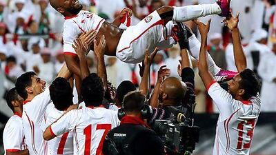 UAE teammates celebrate by tossing Ismail Matar in the air following their 2-1 win over Uzbekistan in an Asian Cup qualifier in Abu Dhabi on Friday night. Satish Kumar / The National