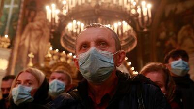 Believers attend a service on the eve of Orthodox Christmas at the Volodymyrsky Cathedral in Kyiv, Ukraine. Reuters