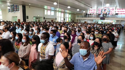 People attend Easter Sunday Mass at St Mary's Dubai. Pawan Singh / The National