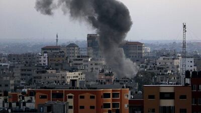 Smoke and dust rise after an Israeli strike hit Gaza City in the northern Gaza Strip on Wednesday. Adel Hana / AP