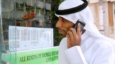 Consumers will be able to switch mobile operator but keep their number by the end of March, says the head of the Emirates' regulator. AFP PHOTO