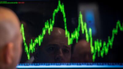 A trader watches his chart while working on the floor of the New York Stock Exchange. Photo: Reuters