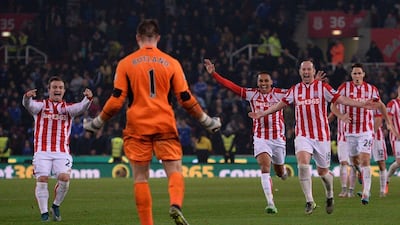 Stoke City players rush to celebrate with keeper Jack Butland after their League Cup fourth round win on Tuesday over Chelsea. Oli Scarff / AFP
