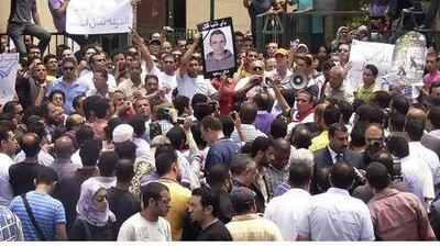Egyptians shout anti-police slogans during a protest in Alexandria, Egypt. Police are accused of beating a young businessman to death.