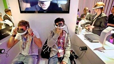 Sony's personal 3-D viewers are now being sold in the UAE. Above, visitors try on Sony's latest gadget in an electronics fair in Berlin. Sean Gallup / Getty Images