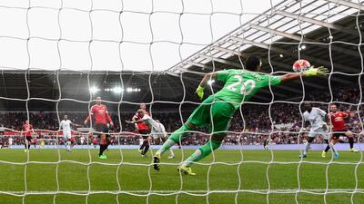 Swansea's Andre Ayew scores the opening goal against Manchester United on Sunday to make it 1-1 at the Liberty Stadium. Stu Forster / Getty Images